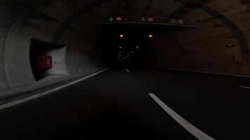 First person view car entering a tunnel in the mountains. The highway leads into the tunnel, showcasing the engineering marvel of mountain highways video