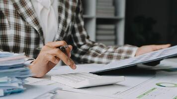 Financial analysts analyze business financial reports on a digital tablet planning investment project during a discussion at a meeting of corporate showing the results of their successful teamwork. video