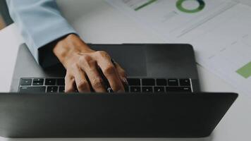 Financial analysts analyze business financial reports on a digital tablet planning investment project during a discussion at a meeting of corporate showing the results of their successful teamwork. video