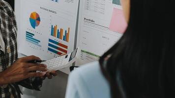 Close up Business woman using calculator and laptop for do math finance on wooden desk in office and business working background, tax, accounting, statistics and analytic research concept video