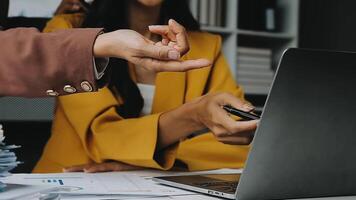 Financial analysts analyze business financial reports on a digital tablet planning investment project during a discussion at a meeting of corporate showing the results of their successful teamwork. video