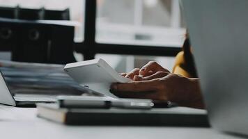 Financial analysts analyze business financial reports on a digital tablet planning investment project during a discussion at a meeting of corporate showing the results of their successful teamwork. video