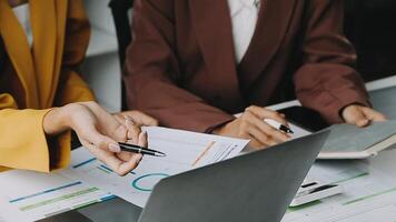 Financial analysts analyze business financial reports on a digital tablet planning investment project during a discussion at a meeting of corporate showing the results of their successful teamwork. video