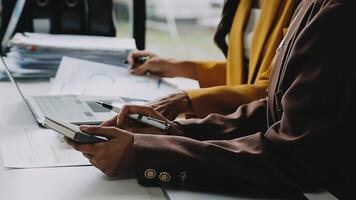 Financial analysts analyze business financial reports on a digital tablet planning investment project during a discussion at a meeting of corporate showing the results of their successful teamwork. video