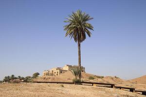 Saddam palace on hill in Babylon with blue sky photo