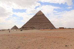 the pyramids of egypt , the pyramid of khufu is the largest pyramid in giza governorate photo