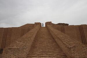 Ziggurat of ur in Iraq with cloudy sky photo