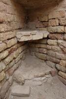 old shelves 2025 bc . shelves below the shelves without restoration , built of bricks in the house of the prophet of god , abraham, may god bless him and grant him peace in ur in Iraq . photo