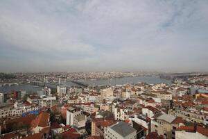 the city of istanbul from a height showing the tall buildings and the intersection of bosphourus strait photo