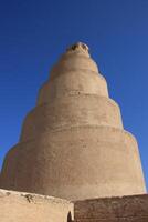 Minaret mosque in samarra with blue sky , ancient ruins in iraq photo