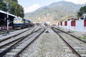 View of train Railway Tracks from the middle during daytime at Kathgodam railway station in India, Train railway track view, Indian Railway junction, Heavy industry photo
