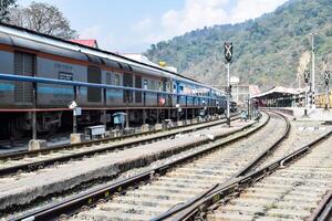 View of train Railway Tracks from the middle during daytime at Kathgodam railway station in India, Train railway track view, Indian Railway junction, Heavy industry photo