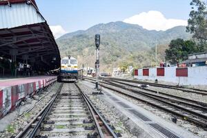 View of train Railway Tracks from the middle during daytime at Kathgodam railway station in India, Train railway track view, Indian Railway junction, Heavy industry photo