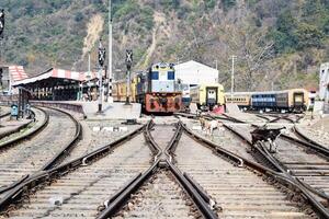 View of train Railway Tracks from the middle during daytime at Kathgodam railway station in India, Train railway track view, Indian Railway junction, Heavy industry photo