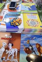 New Delhi, India, May 7 2024 - Variety of Books on shelf inside a book-stall at Delhi International Book Fair, Selection of books on display in Annual Book Fair at Bharat Mandapam complex photo