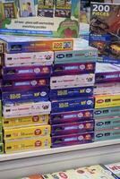 New Delhi, India, February 17 2024 - Variety of Books on shelf inside a book-stall at Delhi International Book Fair, Selection of books on display in Annual Book Fair at Bharat Mandapam complex photo