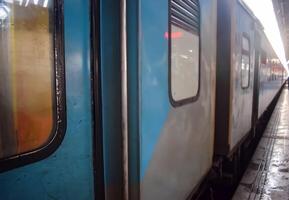 Amritsar, India, May 10 2024 - Indian railway train at Amritsar railway station platform during morning time, Colourful train at Amritsar, Punjab railway station photo