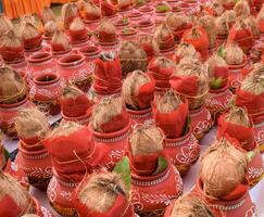 Kalash with coconut and mango leaf with floral decoration earthen pots containing sacred water. Kalash for hindu puja during Jagannath Temple Mangal Kalash Yatra, front view, closeup photo