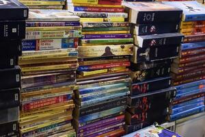 New Delhi, India, May 7 2024 - Variety of Books on shelf inside a book-stall at Delhi International Book Fair, Selection of books on display in Annual Book Fair at Bharat Mandapam complex photo