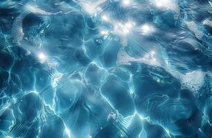 Sunlit water surface with ripples and bubbles, creating a serene and sparkling aquatic scene. photo