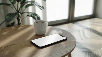 Blank screen smartphone mockup on a minimalist with coffee on the table photo