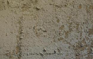 Texture of the old embossed concrete wall in gray color. Background image of a concrete product photo