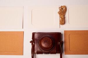 Storage and archiving of photos.Paper frames for photos, an old film camera in the case. Preserving your history. Photo Art.