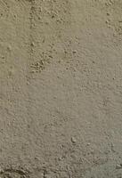 Texture of the old embossed concrete wall in gray color. Background image of a concrete product photo