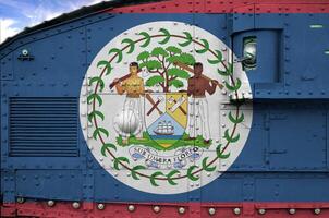 Belize flag depicted on side part of military armored tank closeup. Army forces conceptual background photo