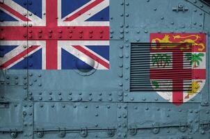 Fiji flag depicted on side part of military armored tank closeup. Army forces conceptual background photo
