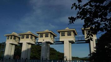 The sluice control building at a dam photo