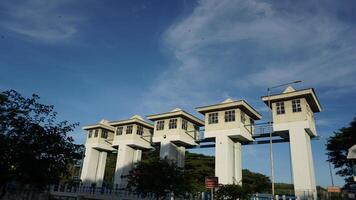 The sluice control building at a dam photo