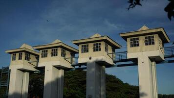 The sluice control building at a dam photo