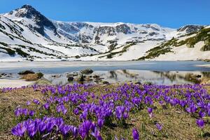 Hike to the Seven Rila lakes, located high in the Rila mountains in Bulgaria. The most visited natural site in the country. Springtime with snow remaining in the mountains. photo