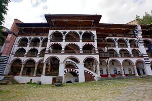View of the Rila Monastery, the largest and most famous Eastern Orthodox monastery in Bulgaria. Famous tourist attractions. Place of worship. photo