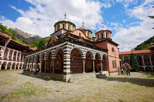 View of the Rila Monastery, the largest and most famous Eastern Orthodox monastery in Bulgaria. Famous tourist attractions. Place of worship. photo