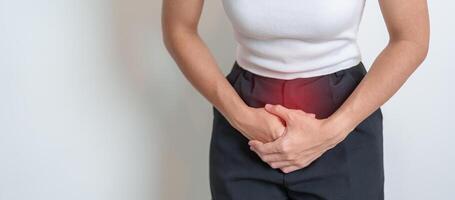 Woman having Stomach pain. Ovarian and Cervical cancer, Cervix disorder, Endometriosis, Hysterectomy, Uterine fibroids, Reproductive system, menstruation, diarrhea, digestive system and Pregnancy photo