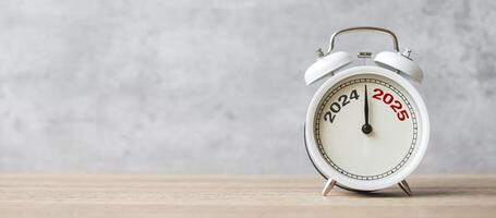 Happy New Year with vintage alarm clock and 2024 change to 2025 number. Merry Christmas, New Start, Resolution, countdown, Goals, Plan, Action and Mission Concept photo