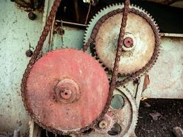 gear mechanism on old agricultural machines with a chain as a connection photo
