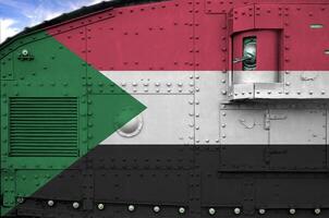 Sudan flag depicted on side part of military armored tank closeup. Army forces conceptual background photo