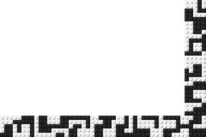 Corner composed of black and white plastic toy blocks. Colorful brick banner isolated on a white background. Simply bricks template. Abstract background vector