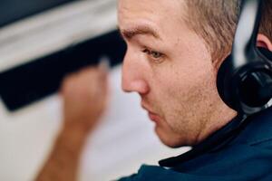 Close Up Portrait of a Customer Support Representative in a Call Center Environment. photo