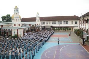 Subang, Indonesia - May 2024, Middle school, high school students and teachers taking part in a ceremony to commemorate National Education Day on the school field photo