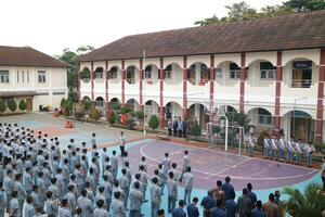 Subang, Indonesia - May 2024, Middle school, high school students and teachers taking part in a ceremony to commemorate National Education Day on the school field photo