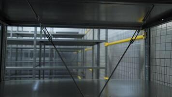 Empty iron shelves in warehouse. Creative. Packaged empty shelves in modern warehouse. Empty warehouse shelves after sending or selling goods video