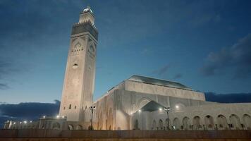 Beautiful square with Mosque and minaret on sunset sky background. Action. Concept of religion and architecture. video