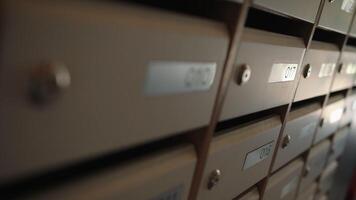 Mailboxes.Stock footage.Small mailboxes in the entrance with apartment numbers on them video