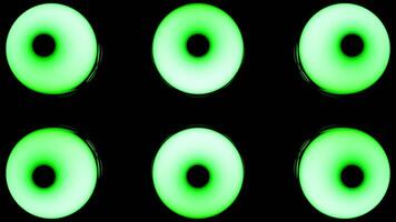 Bright lanterns.Design.A black background on which, in abstraction, bright green and blue sparkling circles with a bright light inside that changes. video