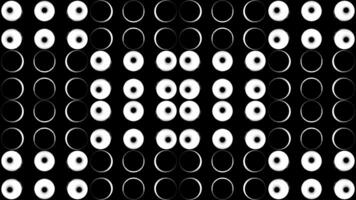 Graphic pattern in black and white with stroboscopic and hypnotic effect. Design. Monochrome glowing round shaped light bulbs. video