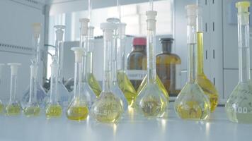 Laboratory test tubes for analysis. Action. Laboratory flasks and test tubes with liquid for analysis and experiments. Laboratory work with test tubes and liquid video